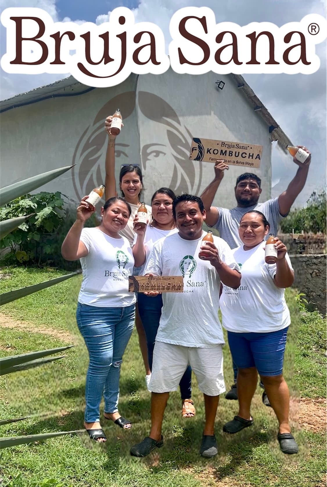 The Bruja Sana team beside the factory mural